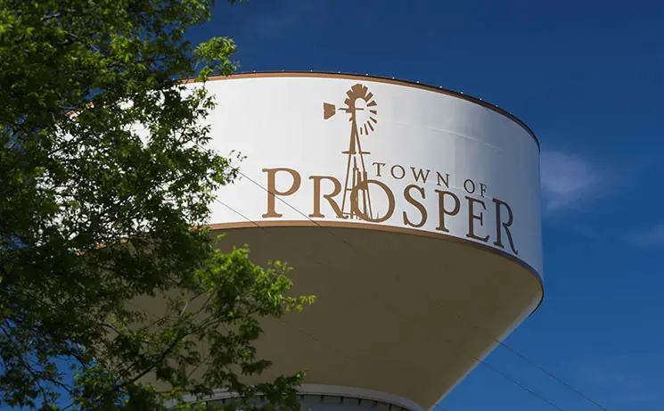 A water tower with the town of prosper written on it.